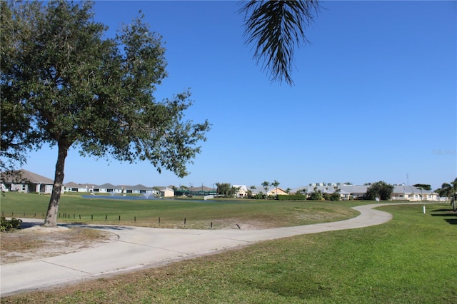 view of community with a residential view and a lawn