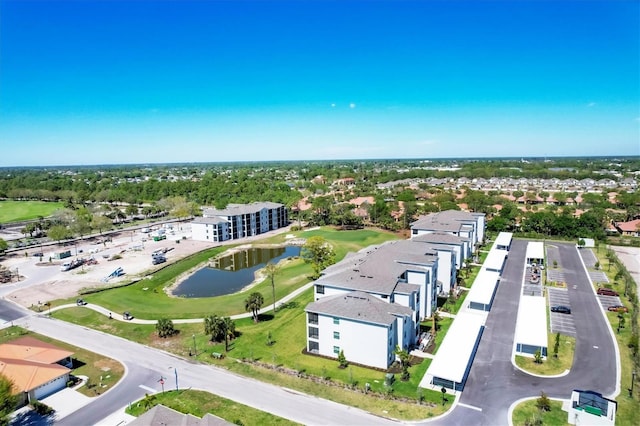 bird's eye view with a water view and golf course view