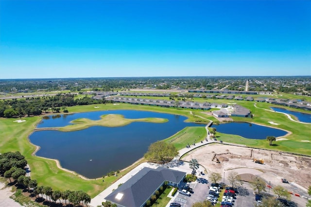 aerial view featuring a water view and view of golf course