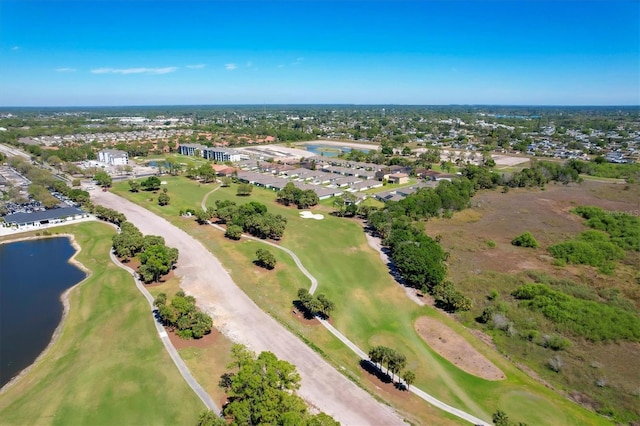 birds eye view of property featuring a water view and view of golf course