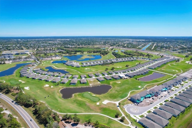 aerial view featuring a residential view, golf course view, and a water view