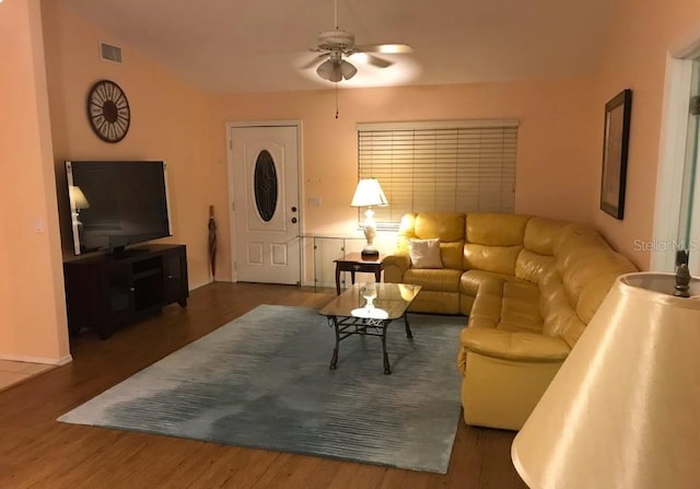 living room with visible vents, ceiling fan, and wood finished floors