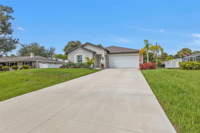 view of front of property featuring stucco siding, driveway, a front yard, and a garage