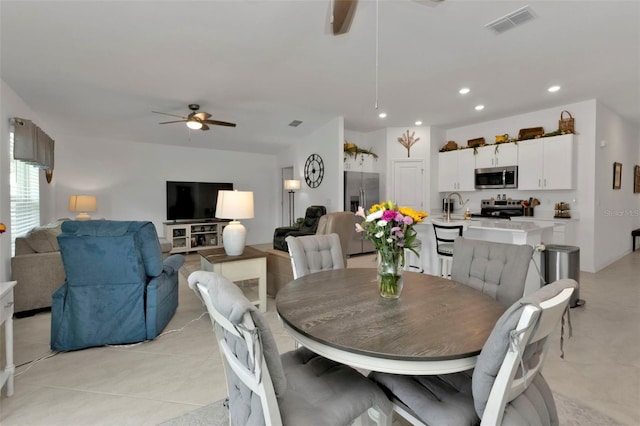 dining area with light tile patterned floors, visible vents, recessed lighting, and a ceiling fan