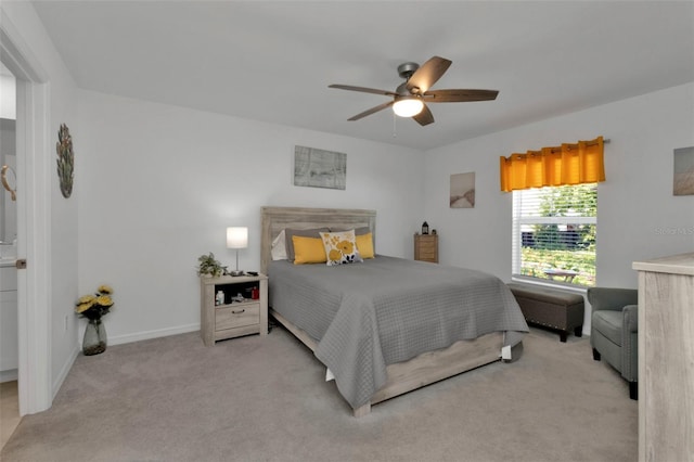 carpeted bedroom featuring baseboards and ceiling fan