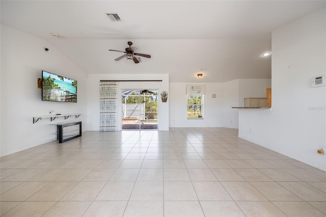 unfurnished living room with lofted ceiling, light tile patterned flooring, visible vents, and ceiling fan