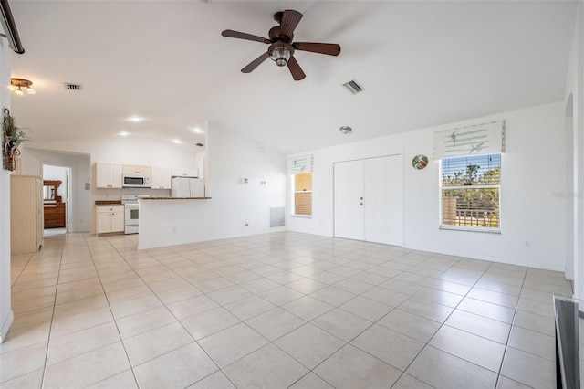 unfurnished living room featuring light tile patterned floors, visible vents, a ceiling fan, and vaulted ceiling