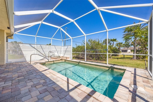 outdoor pool featuring a lanai and a patio area