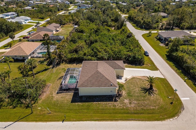 birds eye view of property with a residential view