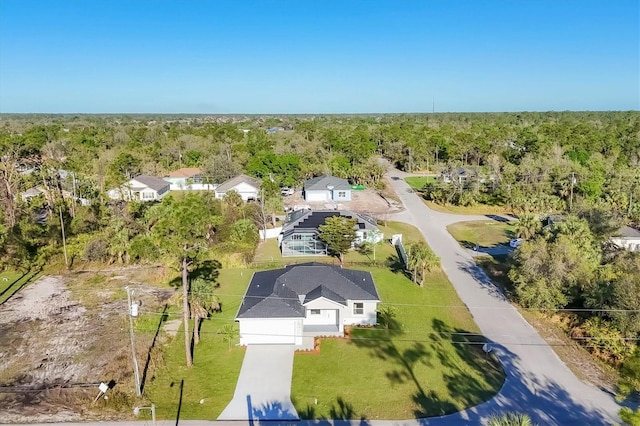 aerial view featuring a wooded view