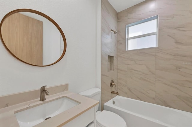 bathroom with vanity, toilet, and  shower combination