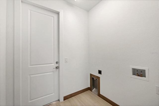 laundry area with electric dryer hookup, washer hookup, light wood-style flooring, baseboards, and laundry area