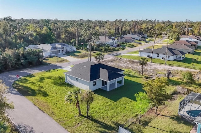 birds eye view of property with a forest view and a residential view