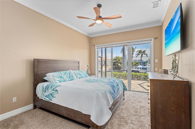 carpeted bedroom with visible vents, baseboards, access to exterior, and ornamental molding