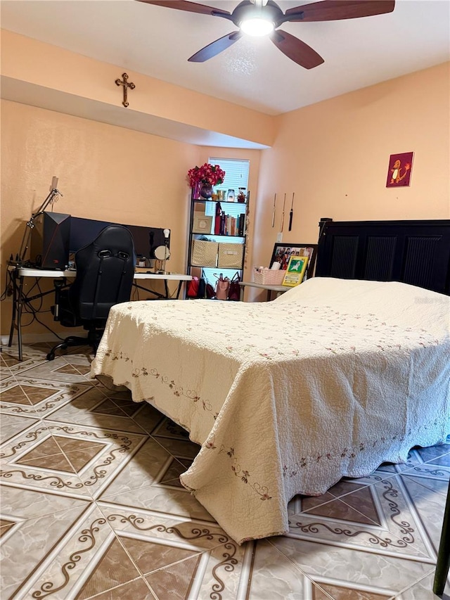 bedroom featuring tile patterned flooring and ceiling fan