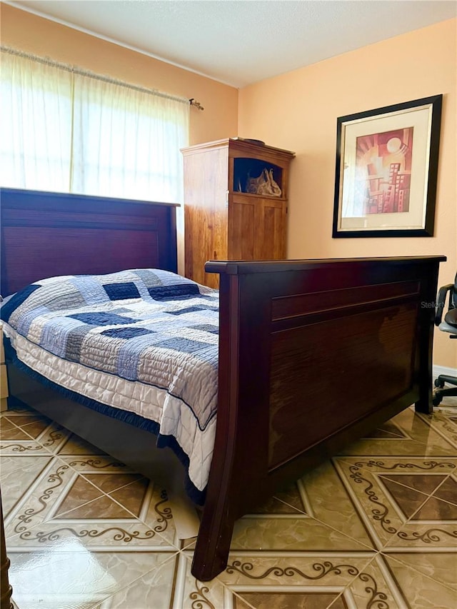 bedroom featuring tile patterned flooring