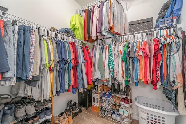 spacious closet with wood finish floors