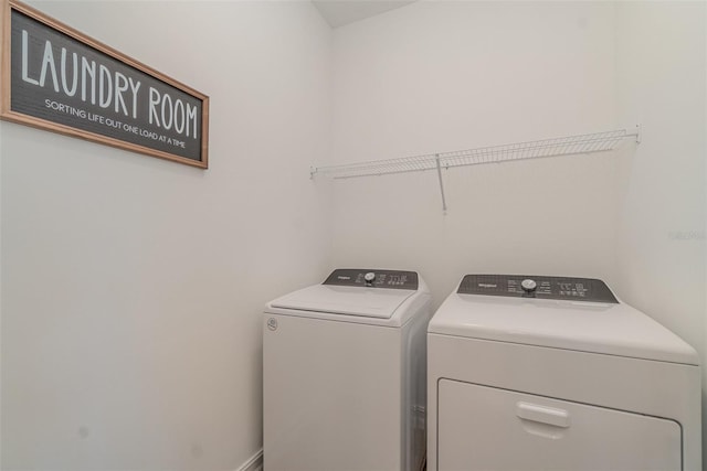 laundry room featuring washing machine and clothes dryer and laundry area