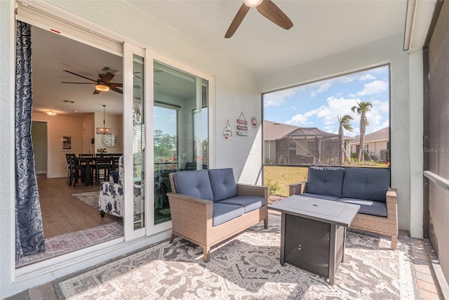 sunroom / solarium with plenty of natural light and ceiling fan