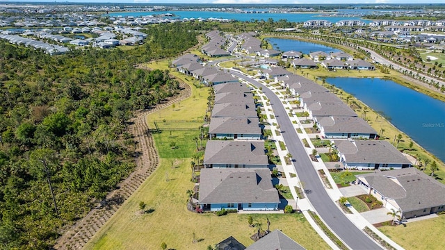 birds eye view of property featuring a residential view and a water view