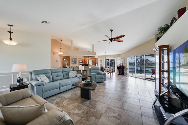 living room featuring visible vents, high vaulted ceiling, and a ceiling fan