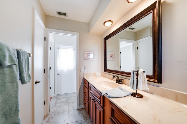 bathroom featuring visible vents and vanity