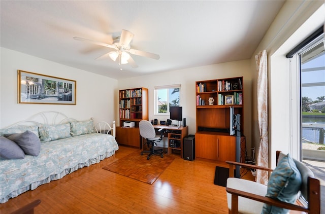 office space featuring a ceiling fan and light wood finished floors