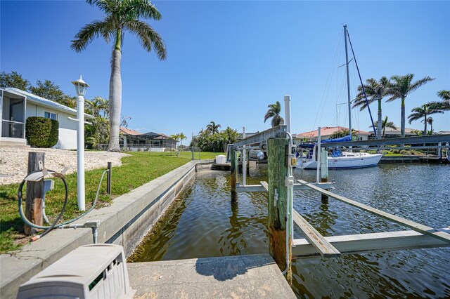 view of dock featuring boat lift and a water view