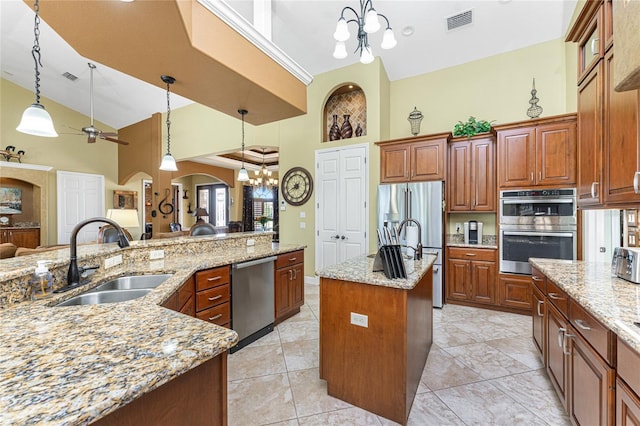 kitchen featuring visible vents, high vaulted ceiling, an island with sink, stainless steel appliances, and a sink