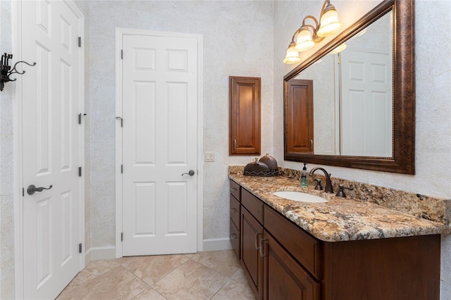 bathroom featuring vanity and baseboards