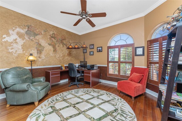 office space with baseboards, wood finished floors, wainscoting, and crown molding