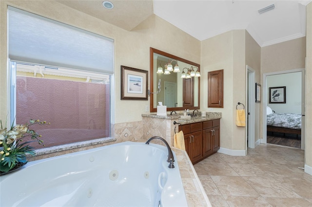 ensuite bathroom with visible vents, baseboards, a whirlpool tub, ensuite bathroom, and vanity