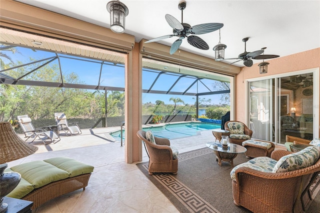 sunroom with a swimming pool and ceiling fan