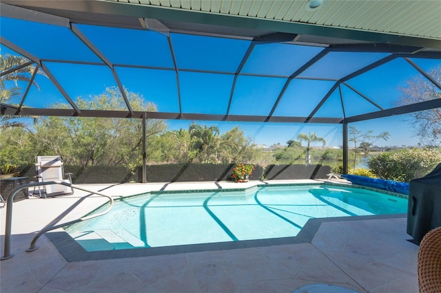 outdoor pool featuring a patio and a lanai