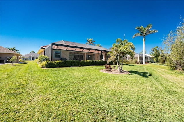 view of yard featuring a lanai