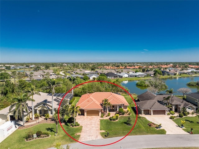 aerial view featuring a residential view and a water view