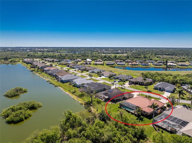 aerial view with a residential view and a water view