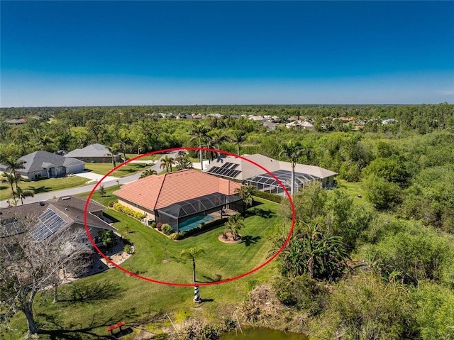 birds eye view of property with a wooded view