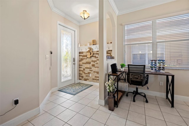 office area featuring light tile patterned floors, arched walkways, crown molding, and baseboards