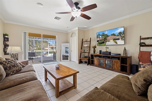 living area featuring crown molding, light tile patterned floors, a ceiling fan, and visible vents