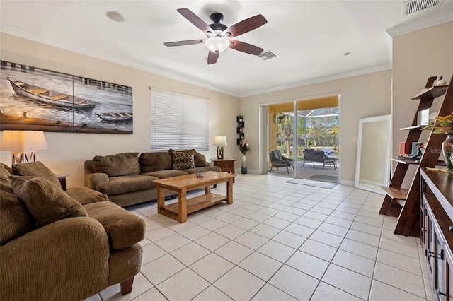 living area with visible vents, crown molding, baseboards, ceiling fan, and light tile patterned floors