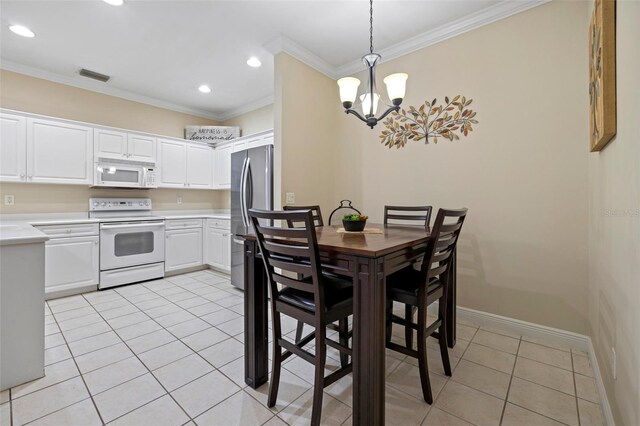 dining area featuring visible vents, ornamental molding, light tile patterned flooring, baseboards, and a chandelier