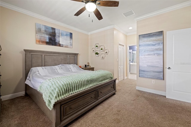 bedroom featuring crown molding, light colored carpet, baseboards, and ensuite bathroom