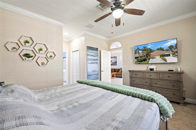 bedroom featuring visible vents, light colored carpet, crown molding, and baseboards