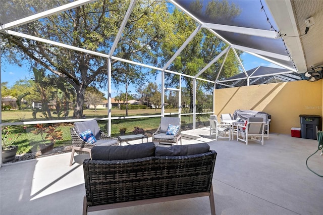 view of patio featuring an outdoor living space and glass enclosure