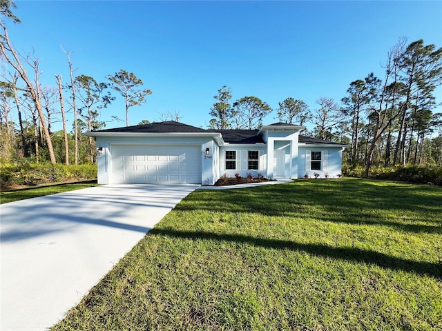 view of front of house featuring stucco siding, a front lawn, concrete driveway, and an attached garage