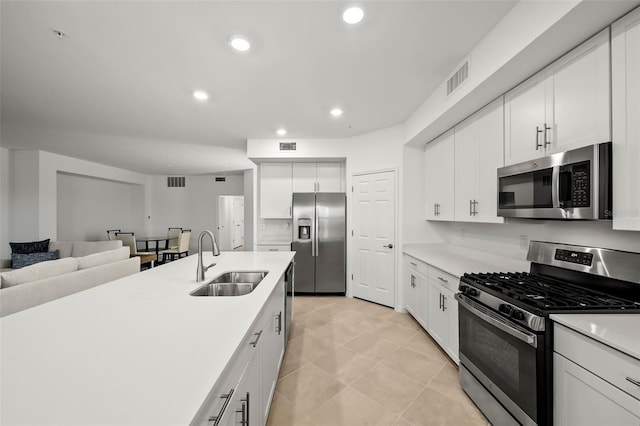 kitchen with visible vents, open floor plan, recessed lighting, appliances with stainless steel finishes, and a sink