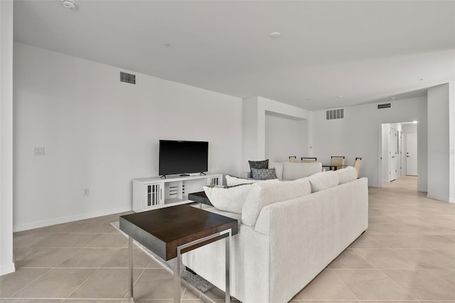 living room with light tile patterned floors and visible vents