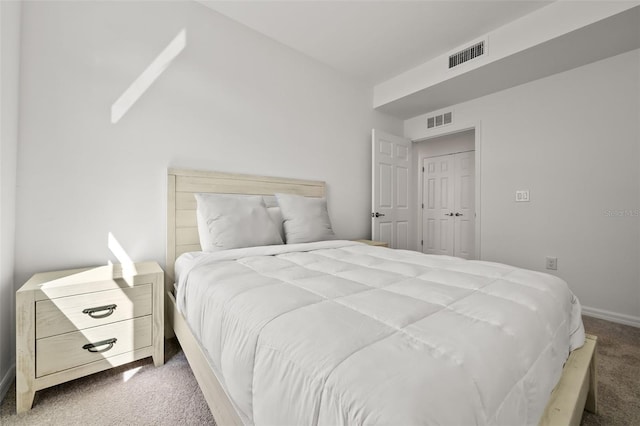 bedroom with baseboards, visible vents, and carpet floors