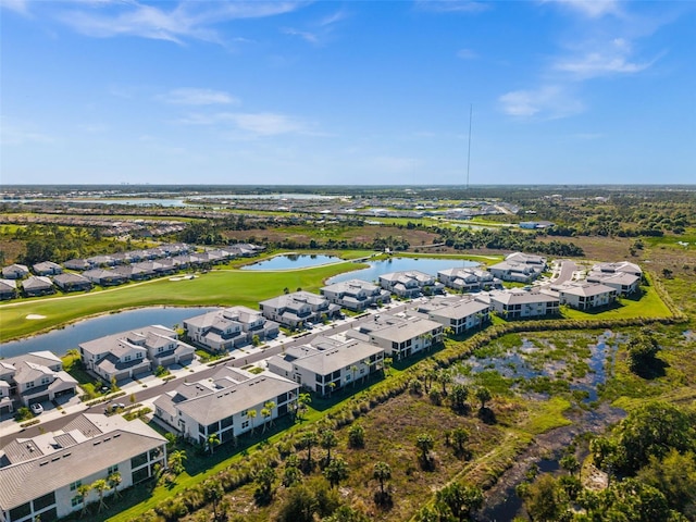 birds eye view of property featuring a residential view, golf course view, and a water view